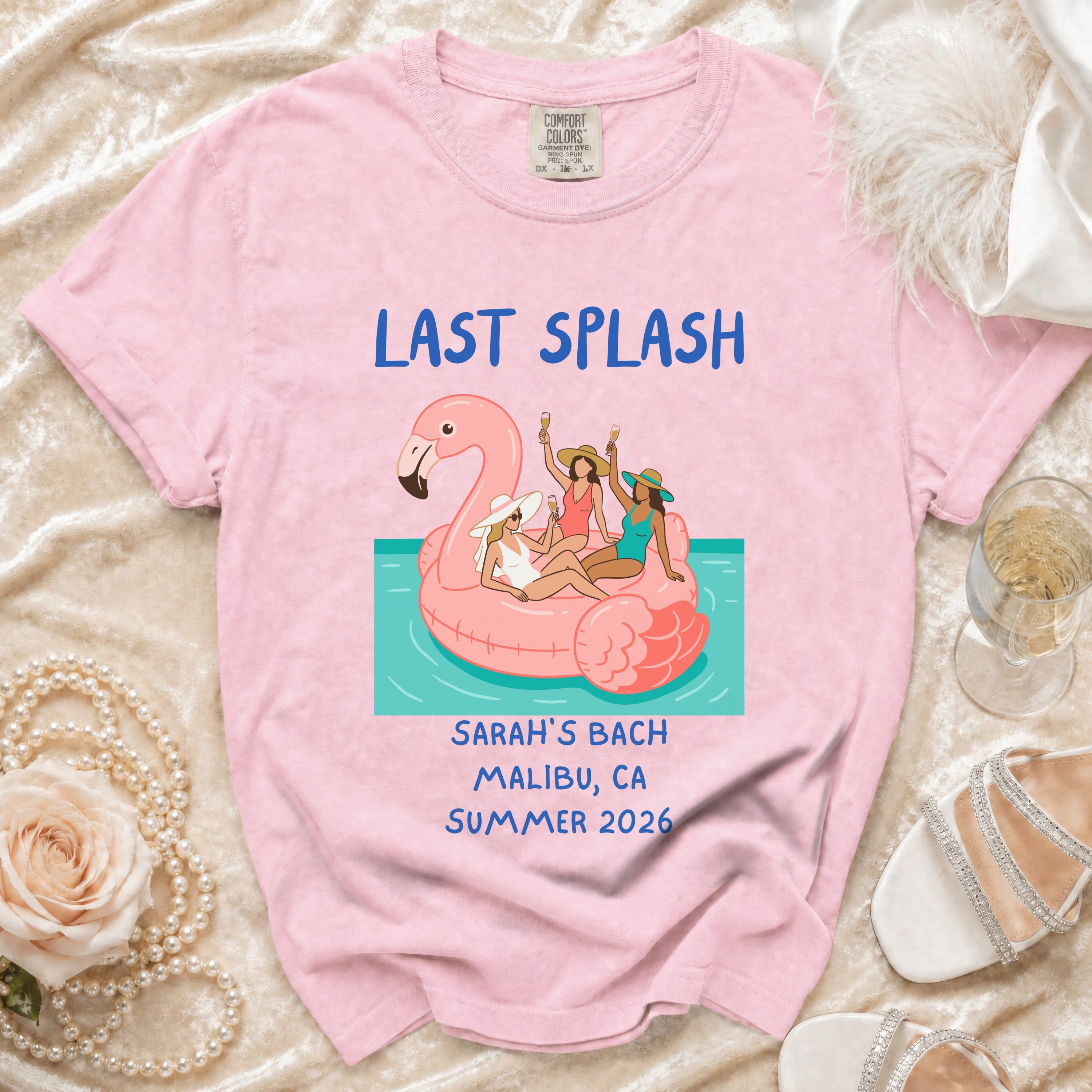 Pink t-shirt with "LAST SPLASH SARAH'S BACH MALIBU, CA SUMMER 2026" text.