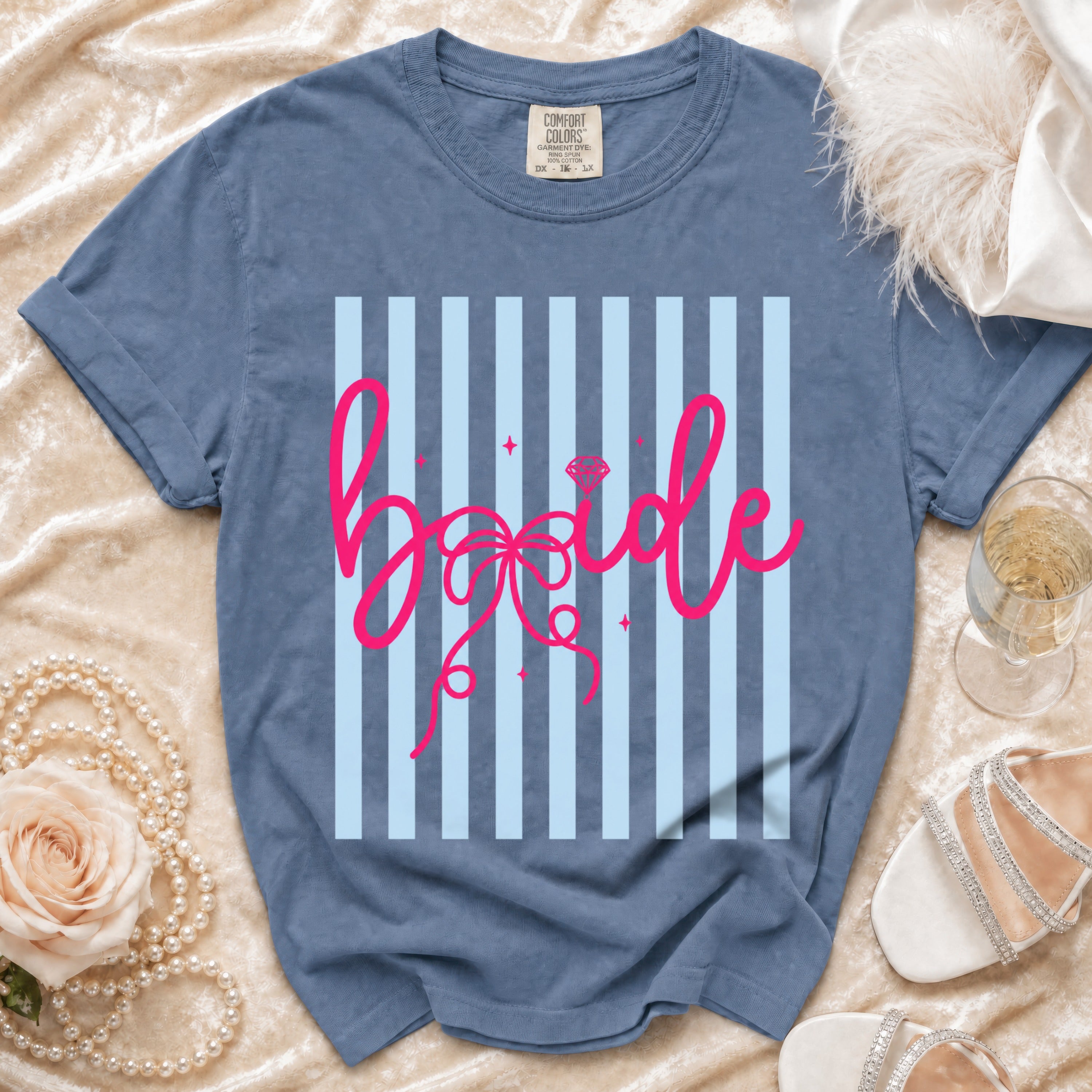 Blue t-shirt with pink "bride" text and a diamond ring graphic.