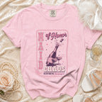 Pink t-shirt with "Maid of Honor Chaos I'm Just Here For Champagne" graphic.