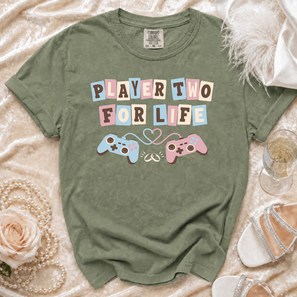 Olive green t-shirt with "Player Two For Life" text and game controllers.