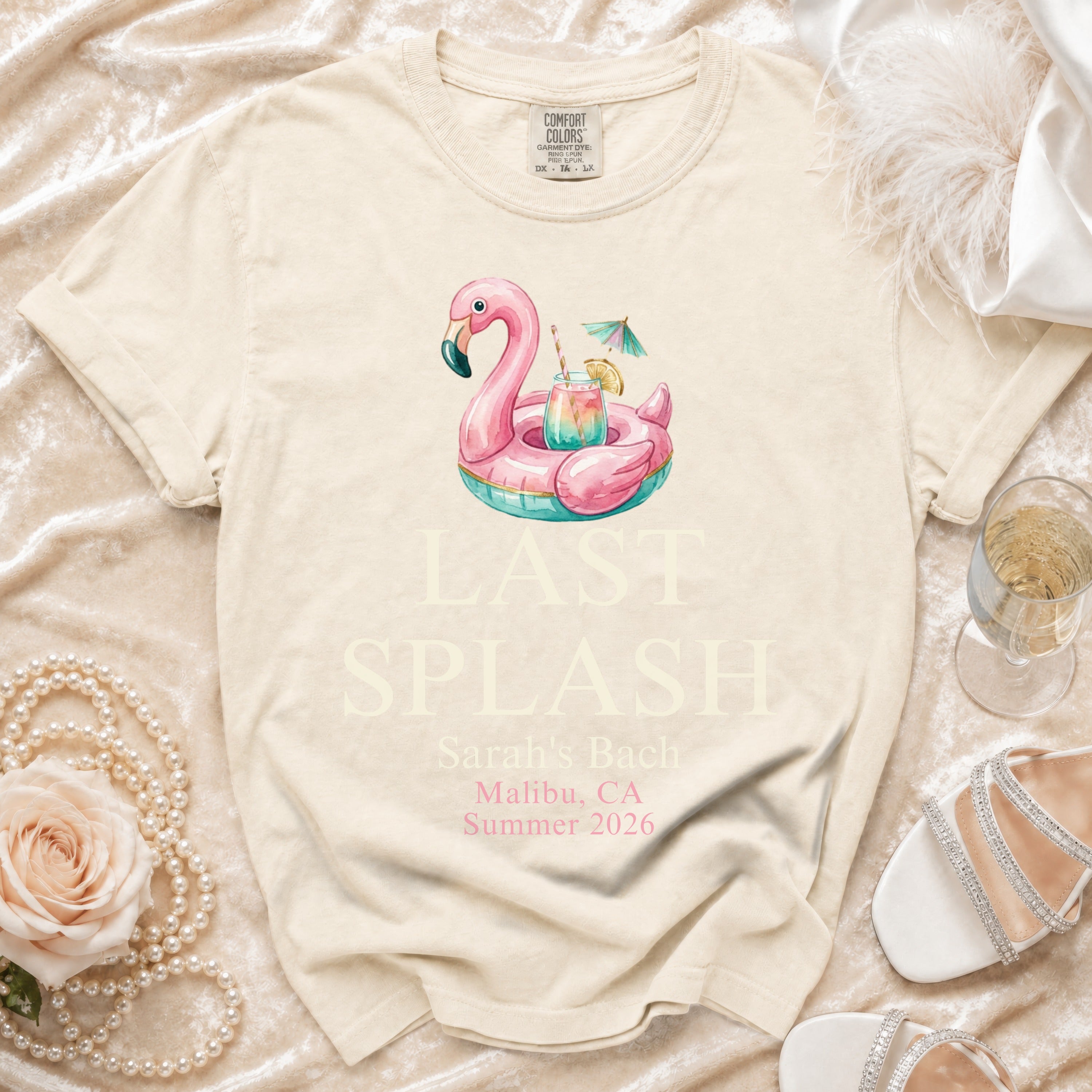 Cream t-shirt with "LAST SPLASH Sarah's Bach Malibu, CA Summer 2026" and flamingo float.