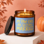 Amber jar candle with blue label reading "MY PAW-ENTS ARE GETTING MARRIED".