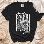 Black t-shirt with "Bride Tribe" graphic featuring champagne glasses, robe, and flowers.