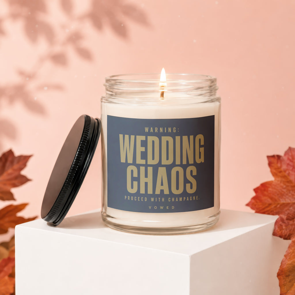 Candle with text "WARNING: WEDDING CHAOS. PROCEED WITH CHAMPAGNE. VOWED".
