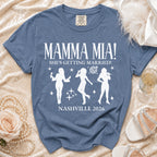 Blue shirt with "MAMMA MIA! SHE'S GETTING MARRIED! NASHVILLE 2026" text.