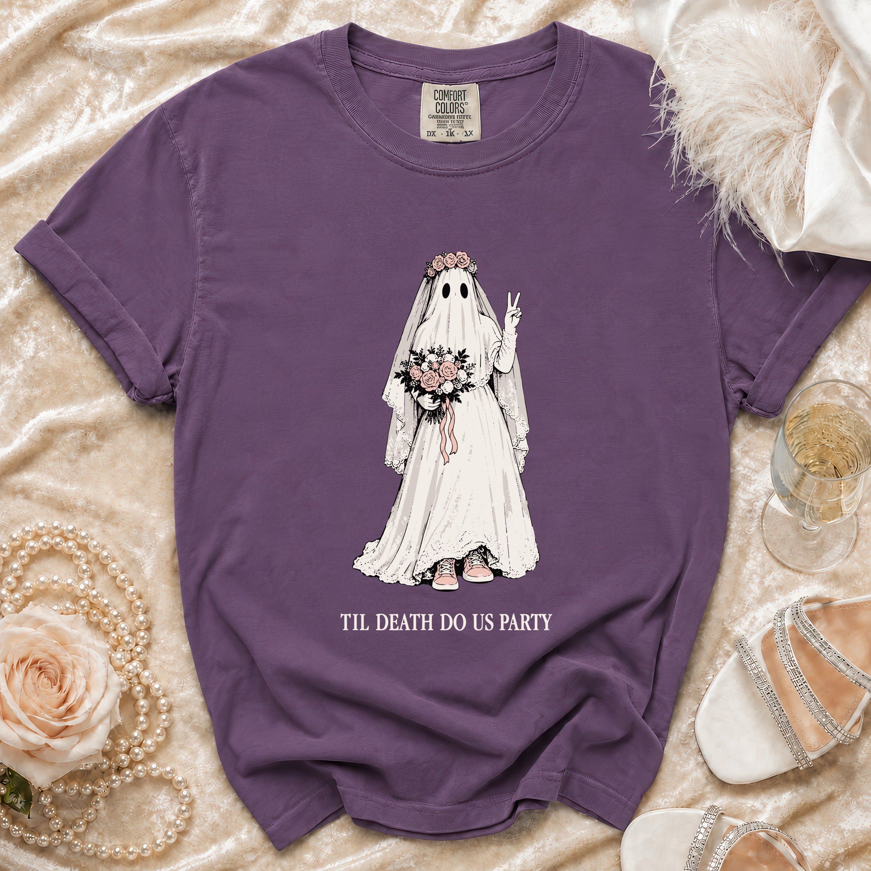Purple t-shirt featuring a ghost bride holding flowers, with text "Til Death Do Us Party".