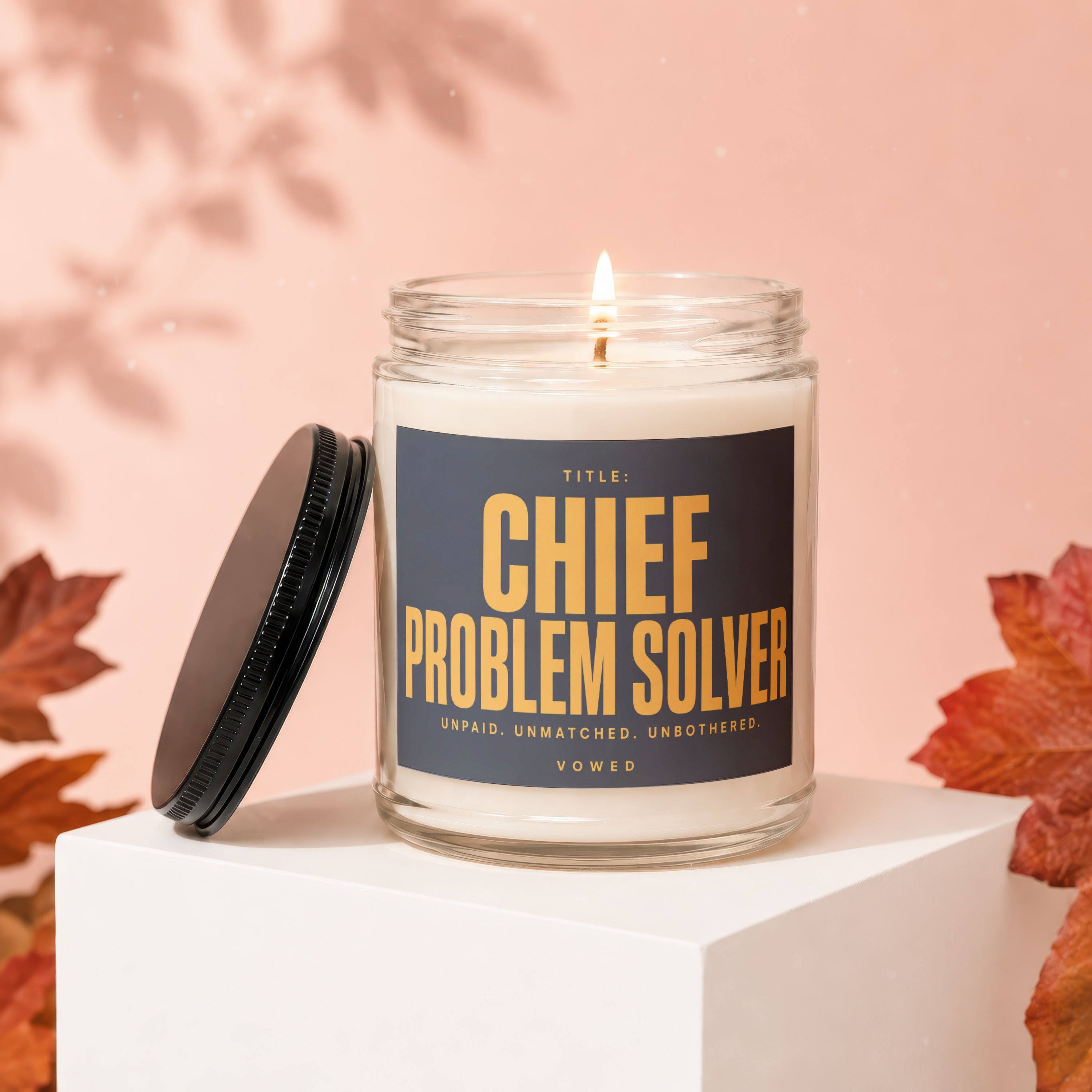 Title: Chief Problem Solver candle with text "unpaid, unmatched, unbothered, vowed".