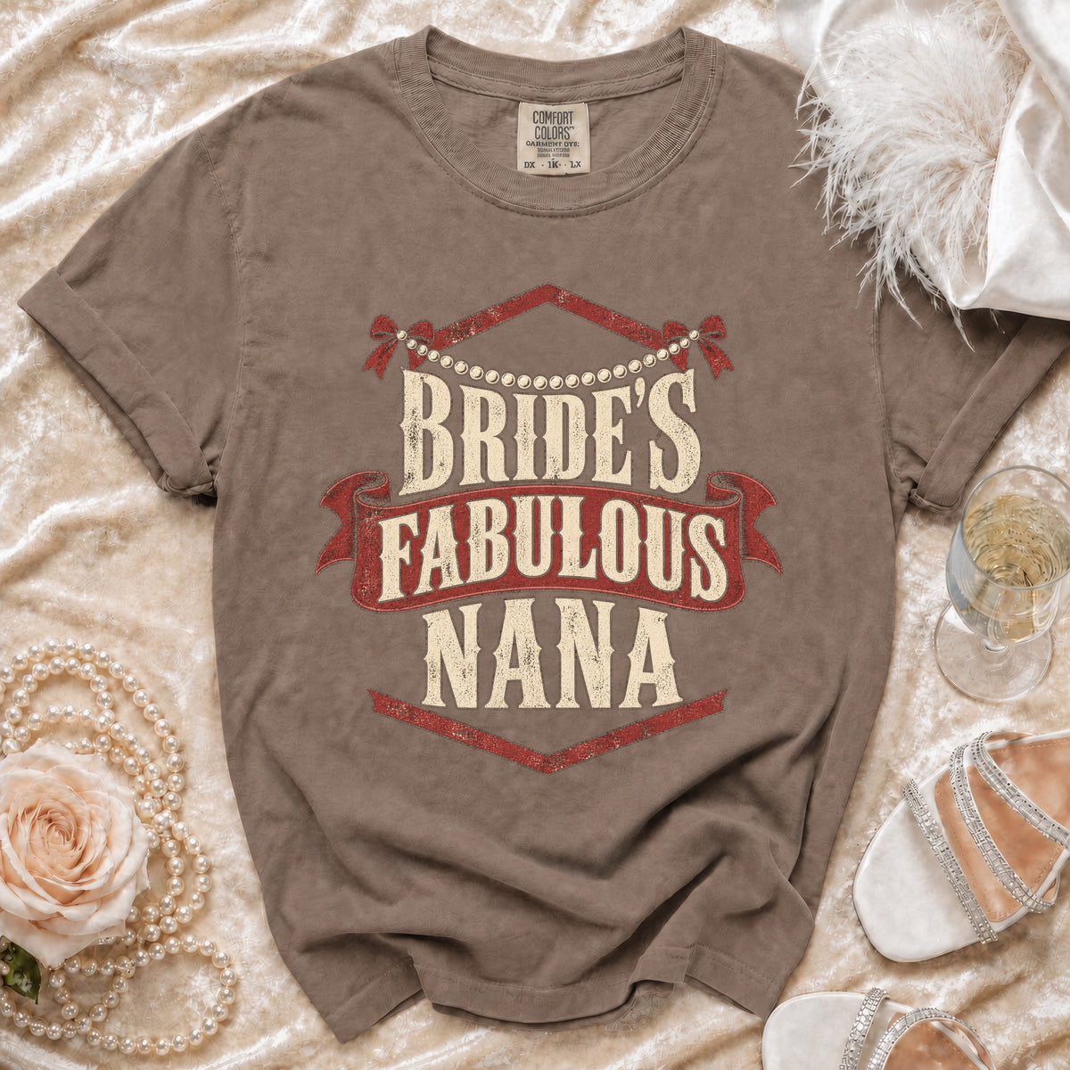 Brown t-shirt with "Bride's Fabulous Nana" text in distressed red and cream design.