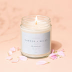 Candle with label "Engaged Harper + Miles the easiest yes 06 | 14 | 27".