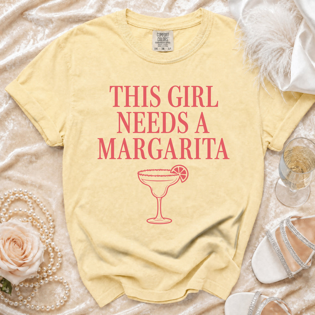 Yellow t-shirt with "This Girl Needs a Margarita" and a margarita graphic.