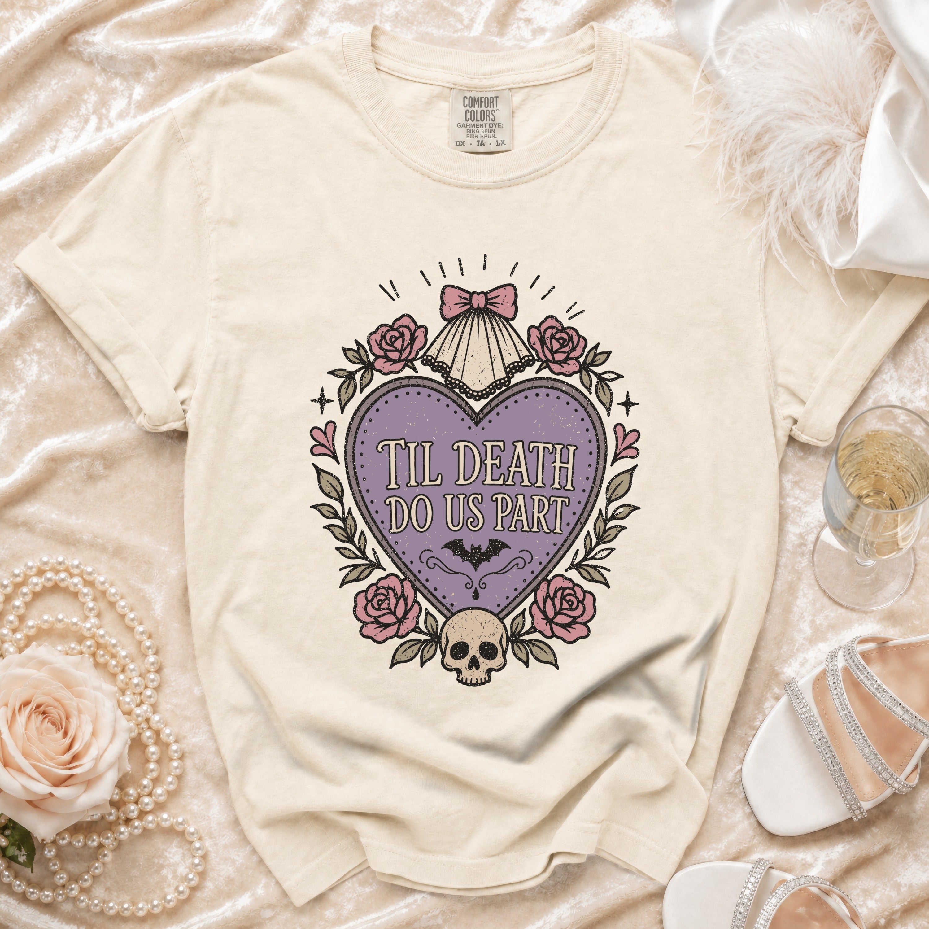 Cream t-shirt with a heart graphic reading "Til Death Do Us Part" and gothic details.