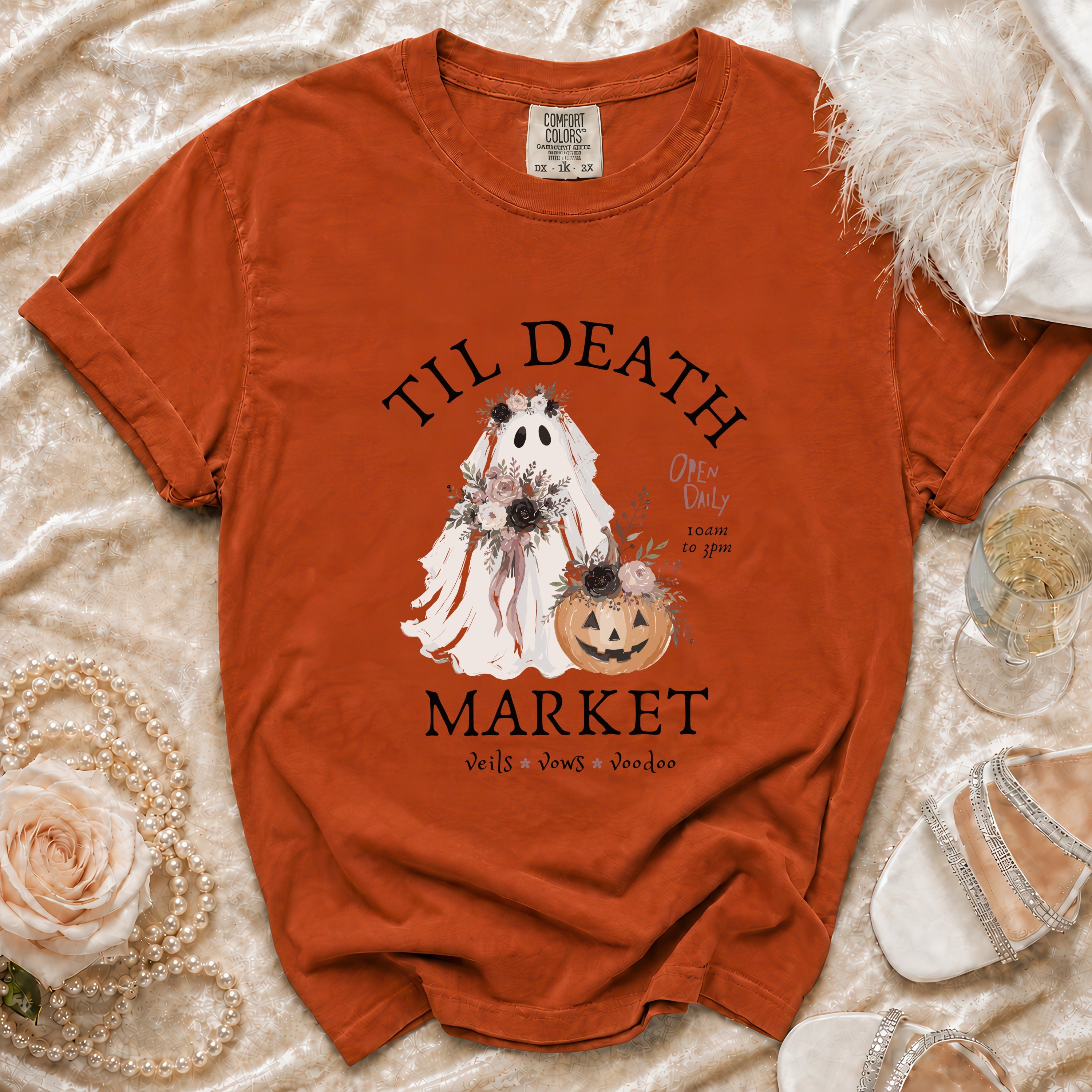 Orange t-shirt with ghost, pumpkin, and text "Til Death Market".