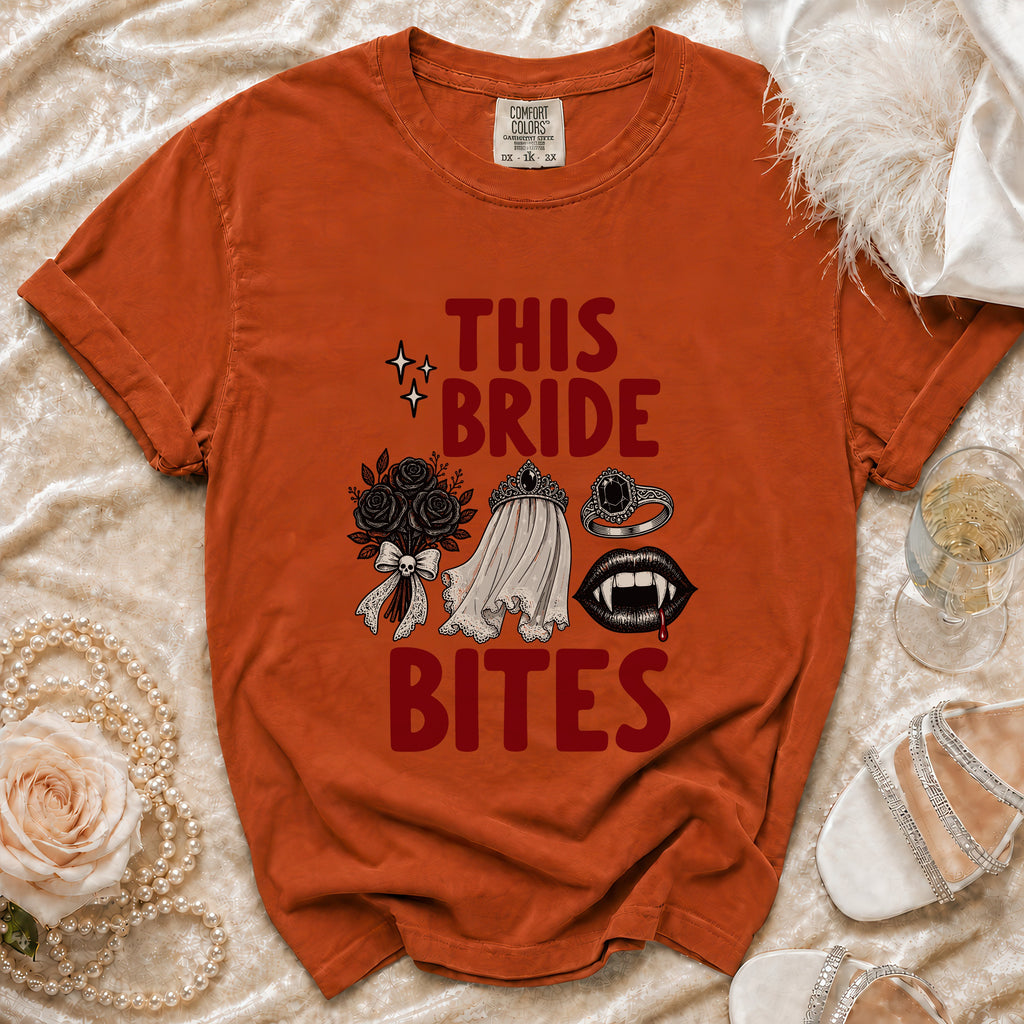 Orange t-shirt with "THIS BRIDE BITES" graphic and vampire-themed illustrations.