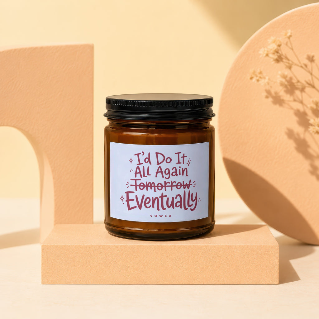 Brown jar candle with white label reading "I'd Do It All Again Tomorrow Eventually".