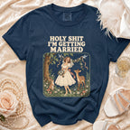 Navy t-shirt with "HOLY SHIT I'M GETTING MARRIED" text and bride illustration.