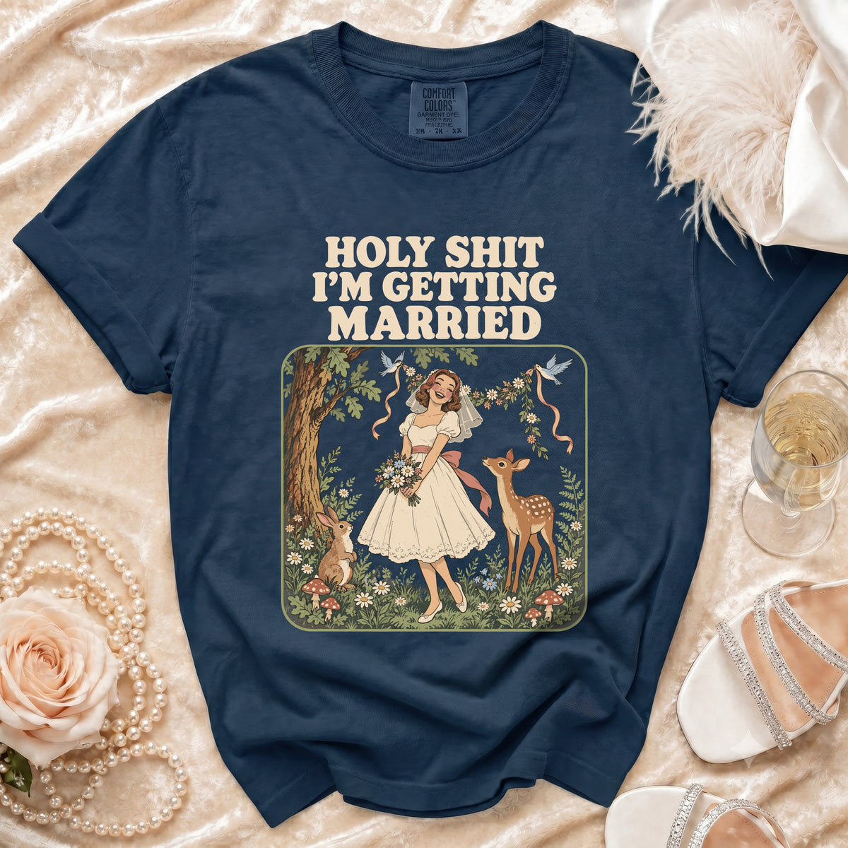 Navy t-shirt with "HOLY SHIT I'M GETTING MARRIED" text and bride illustration.