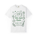 White t-shirt with "Her Last Rodeo" text, cowboy hat, boots, cactus, lasso, and guitar.