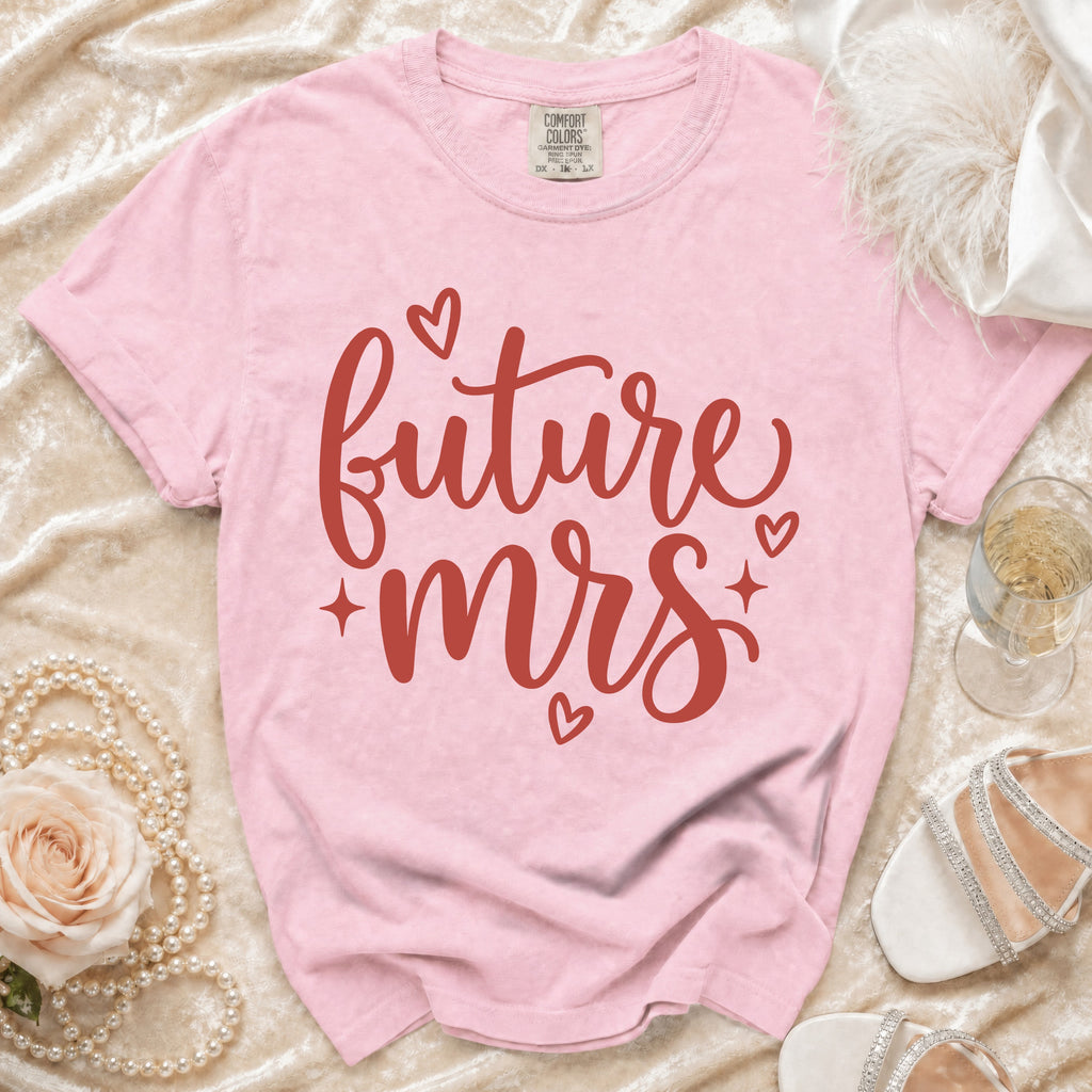 Pink t-shirt with "future mrs" text in red cursive and small hearts.