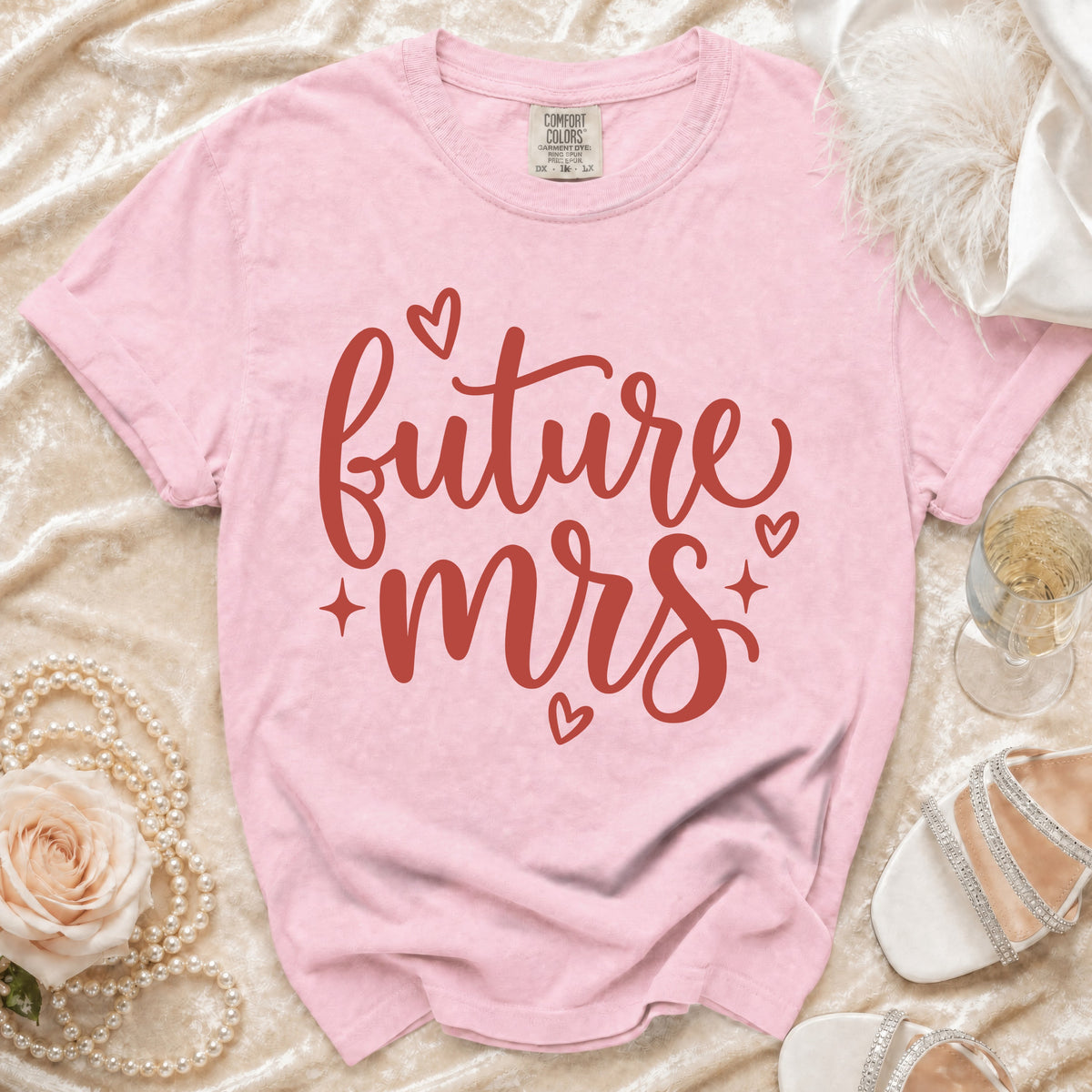 Pink t-shirt with "future mrs" text in red cursive and small hearts.