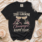 Black t-shirt with "Mother of the Groom Champagne & Happy Tears" text and champagne glasses.