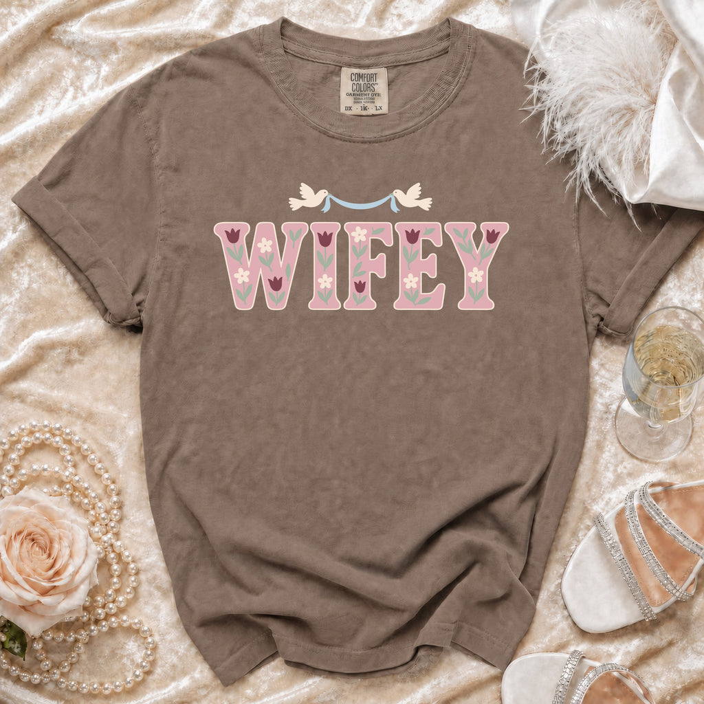 Brown t-shirt with "Wifey" text, floral designs, and doves.