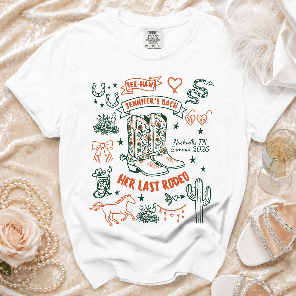 White t-shirt with "Jennifer's Bach" and "Her Last Rodeo" graphics.