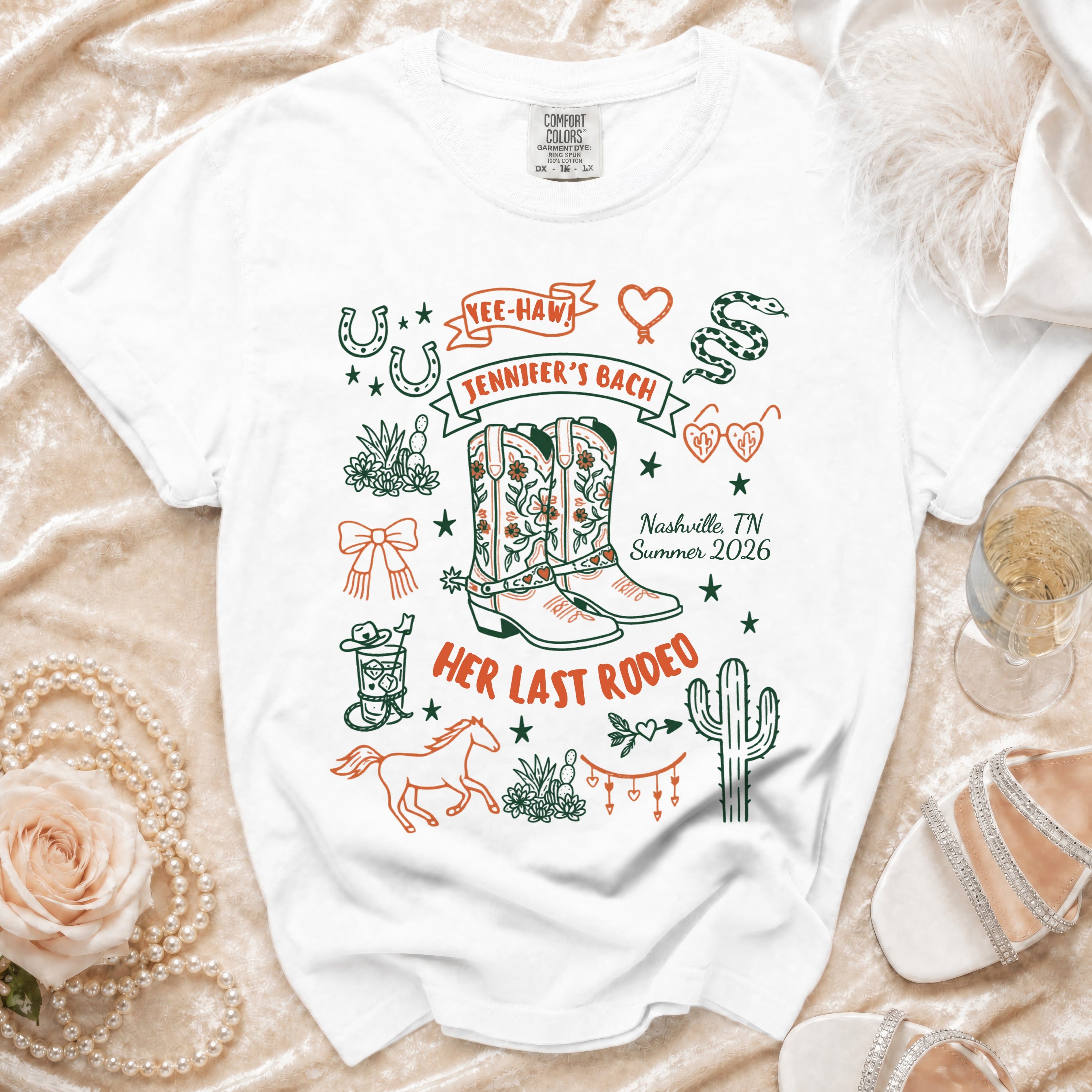 White t-shirt with "Jennifer's Bach" and "Her Last Rodeo" graphics.