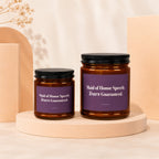 Two amber glass candles with purple labels reading "Maid of Honor Speech: Tears Guaranteed."