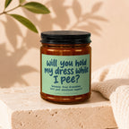 Candle with text "will you hold my dress while I pee?"