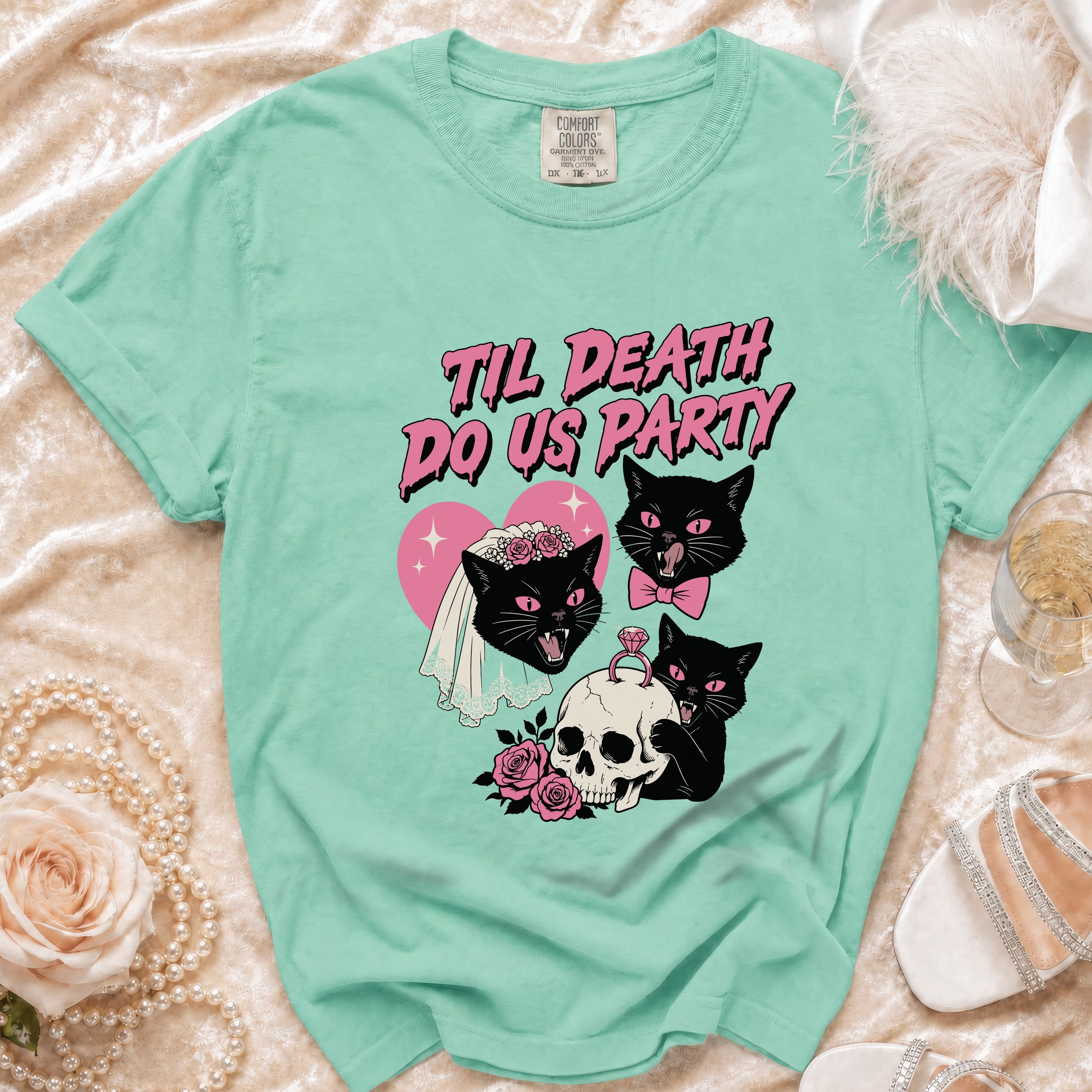 Mint green t-shirt with black cats, skull, and "Til Death Do Us Party" text.