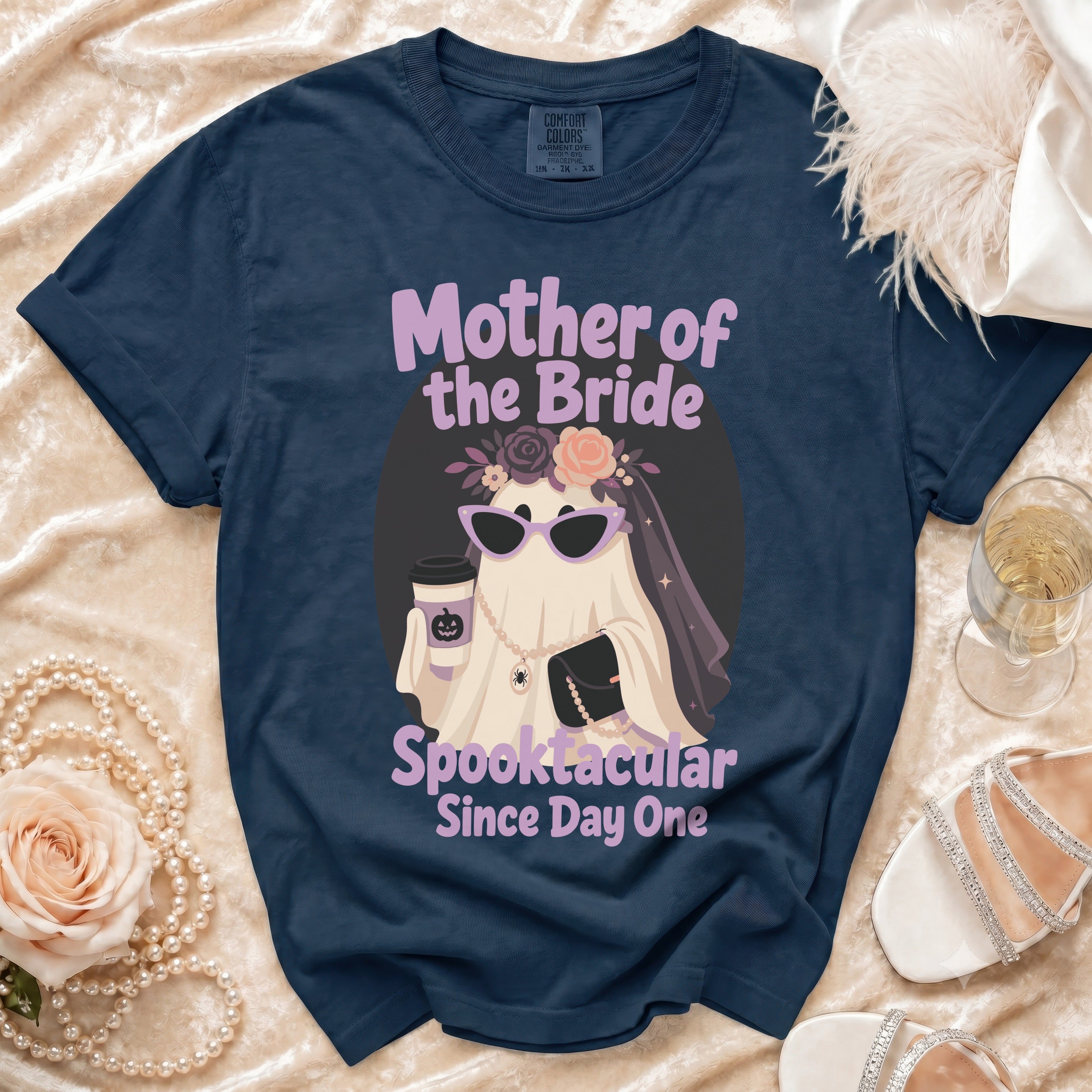 Navy t-shirt with "Mother of the Bride Spooktacular Since Day One" graphic.