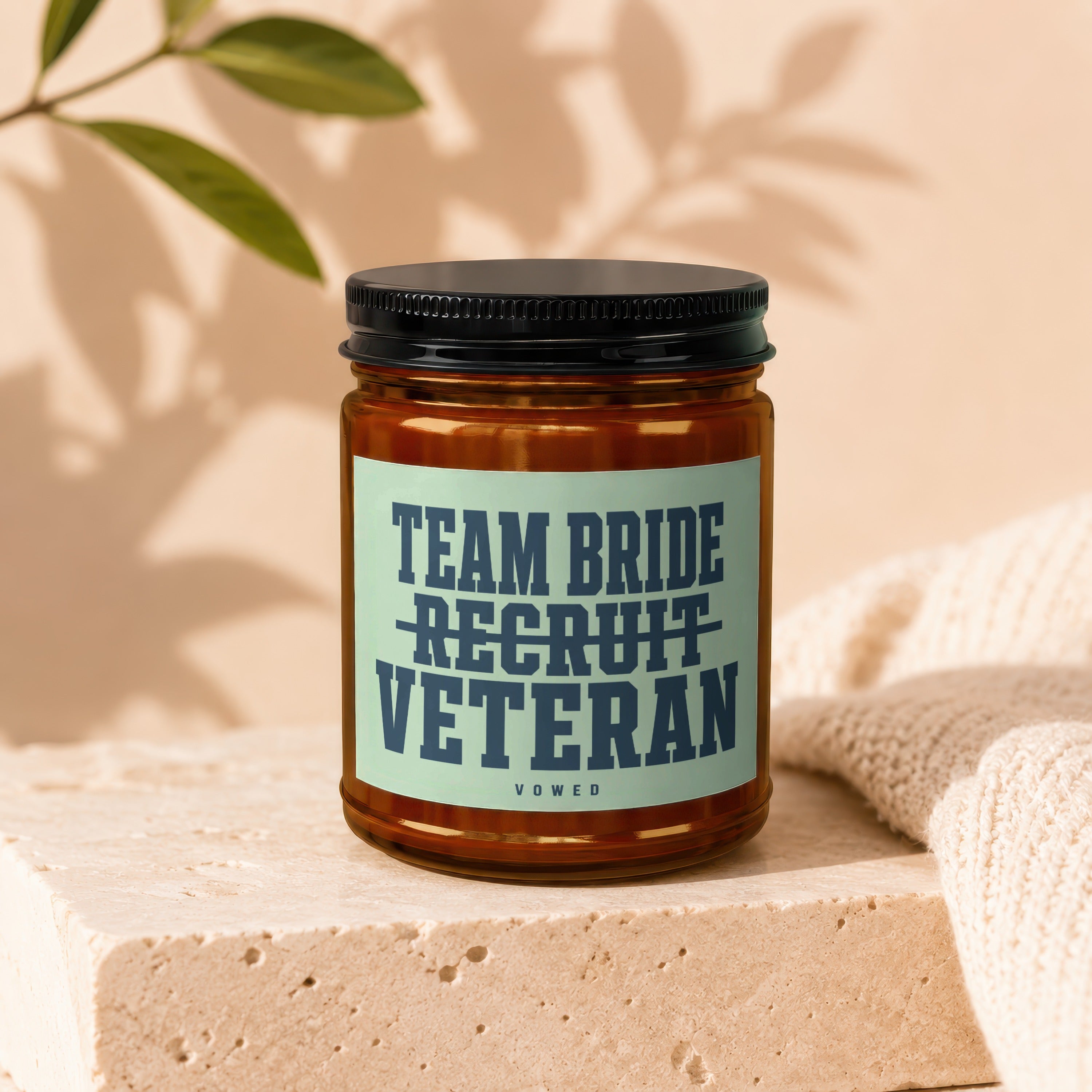 Amber jar candle with "Team Bride Recruit Veteran" text and "Vowed".