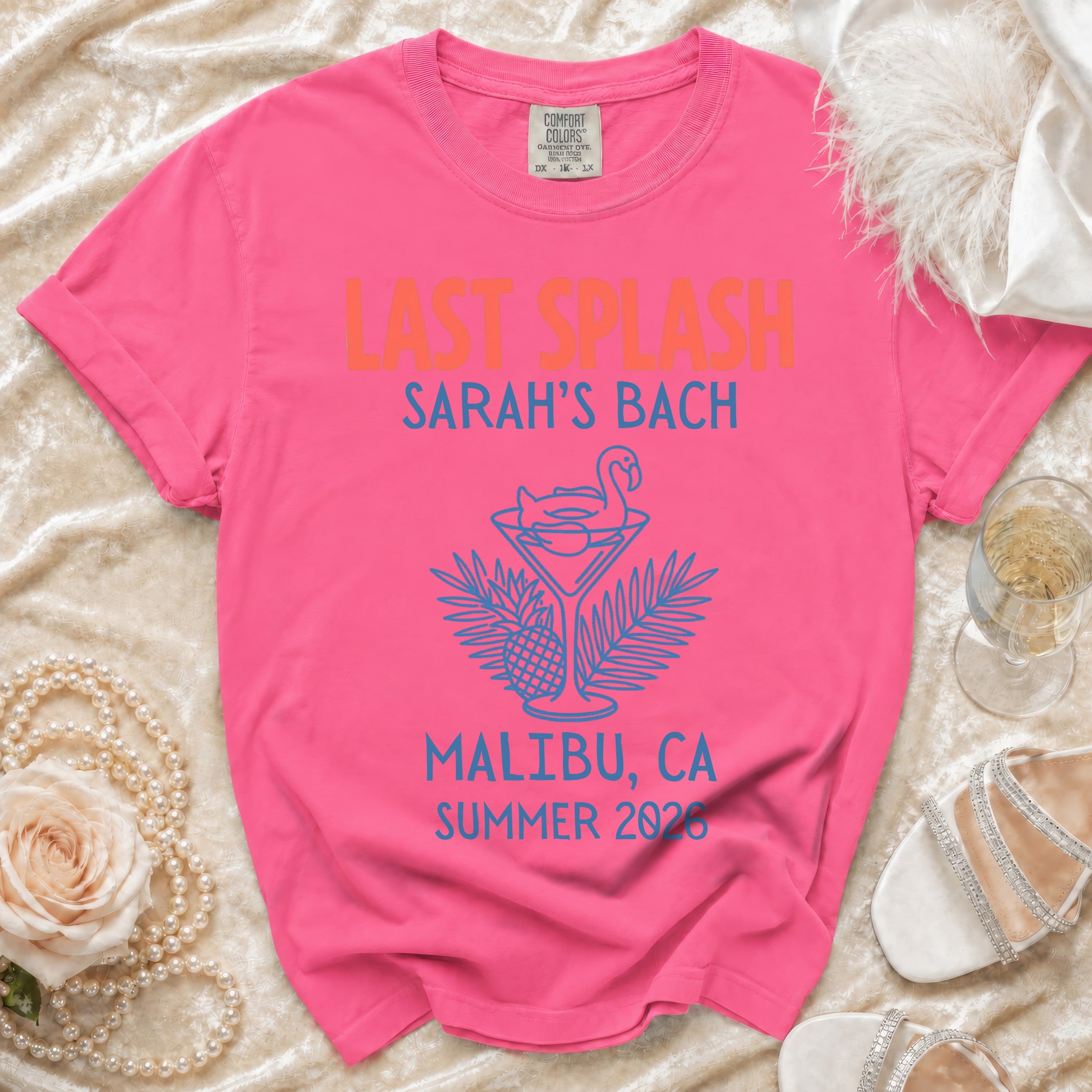 Pink t-shirt with "Last Splash Sarah's Bach Malibu, CA Summer 2026" text and flamingo design.