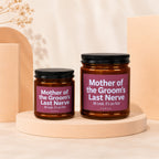 Two amber glass candles with maroon labels that read "Mother of the Groom's Last Nerve".