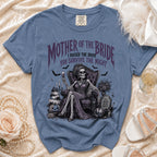 Blue Comfort Colors t-shirt with "Mother of the Bride" skeleton graphic and text.