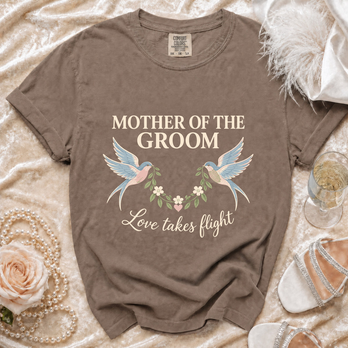 Brown t-shirt with "Mother of the Groom" and "Love takes flight" text.