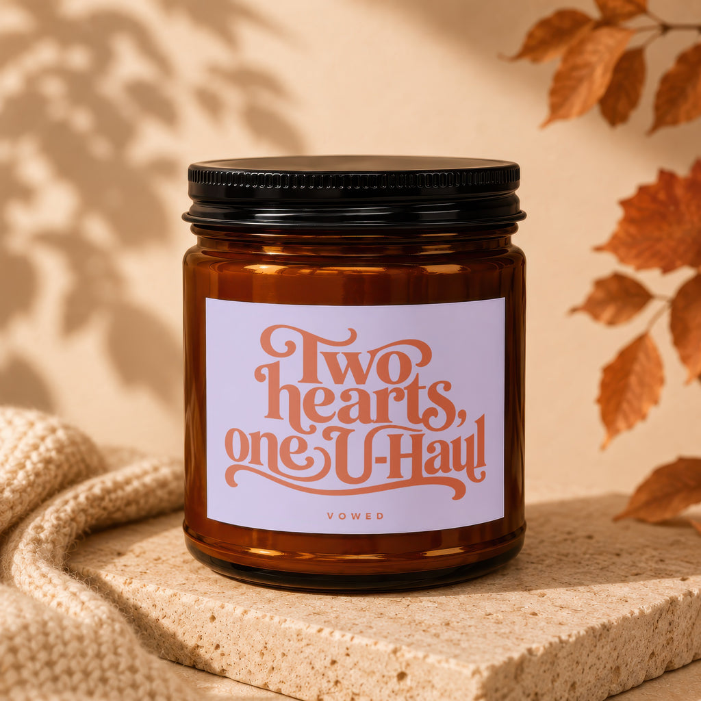 Amber candle with "Two hearts, one U-Haul" text and "VOWED" below.