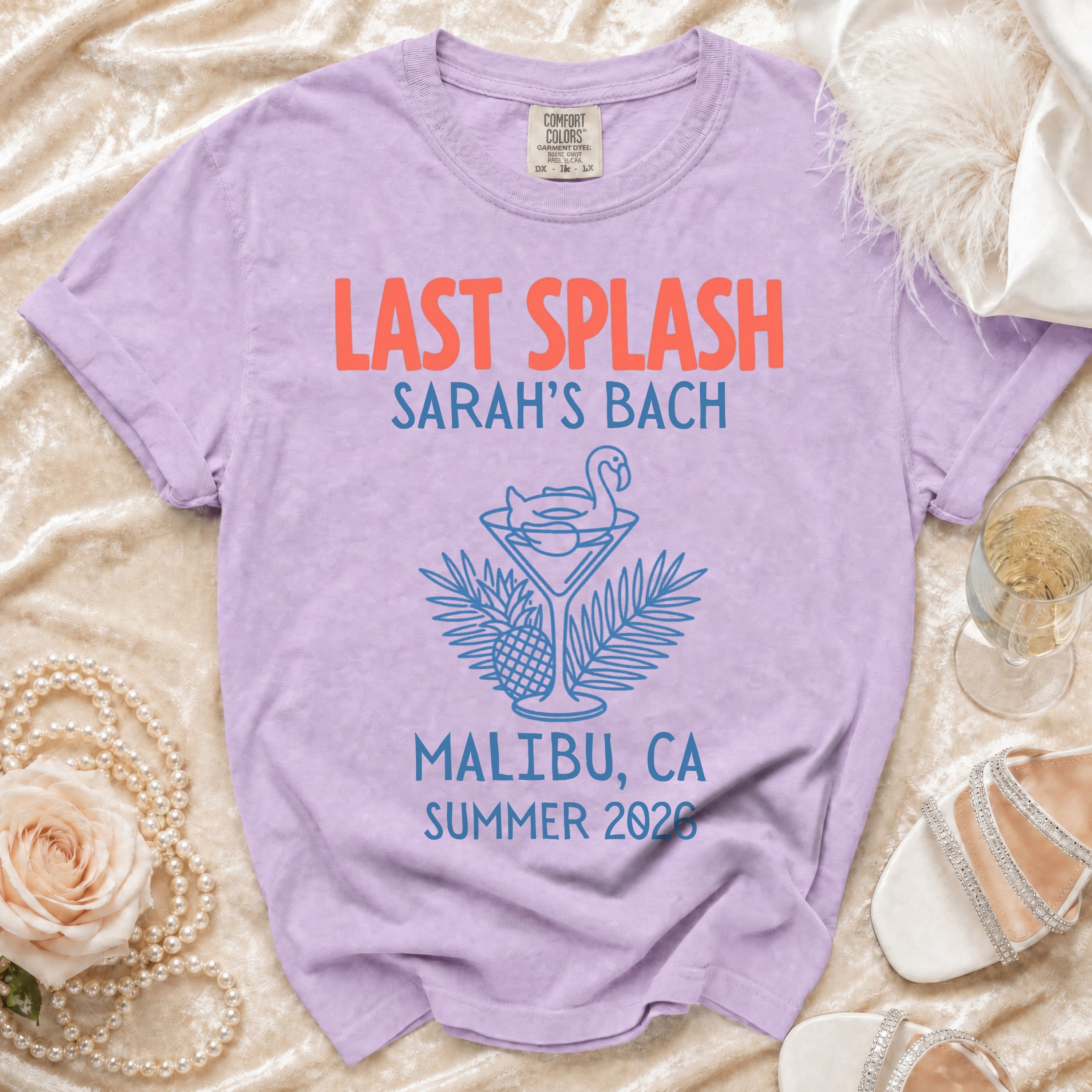 Purple t-shirt with "Last Splash Sarah's Bach Malibu, CA Summer 2026" text.
