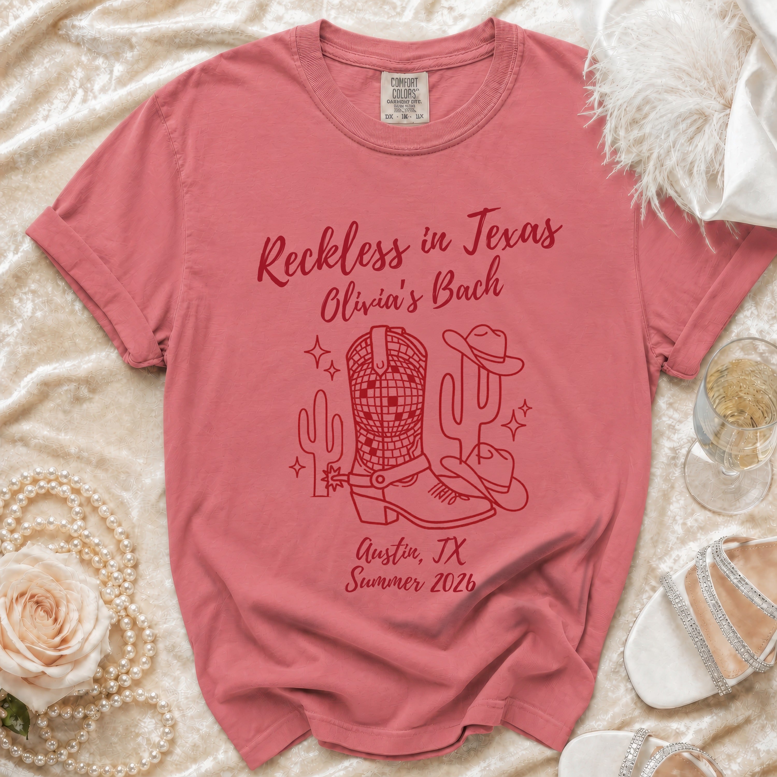 "Reckless in Texas" graphic t-shirt with cowboy boot and cactus design.