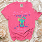 Pink t-shirt with "Last Splash Sarah's Bach Malibu, Ca Summer 2026" and tiki mask graphic.