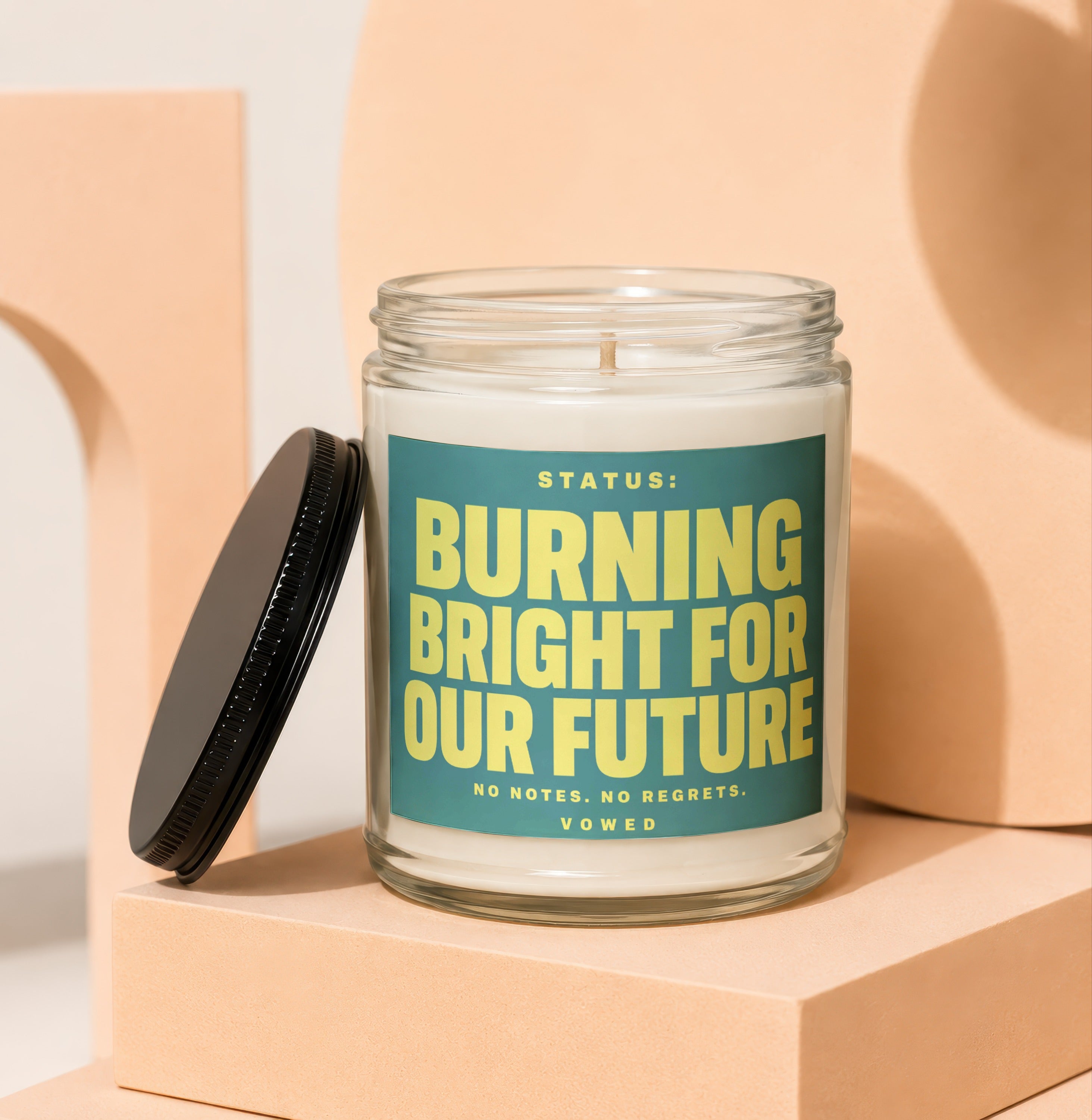 Candle with text "STATUS: BURNING BRIGHT FOR OUR FUTURE NO NOTES. NO REGRETS. VOWED."