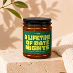 Glass jar with green label reading "BOOKED: A LIFETIME OF DATE NIGHTS"