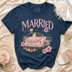 Navy t-shirt with "MARRIED" and a pink wedding car graphic.