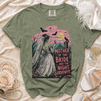 Green t-shirt graphic with a bride, bats, and text "Mother of the Bride ...and the Night Survivor".