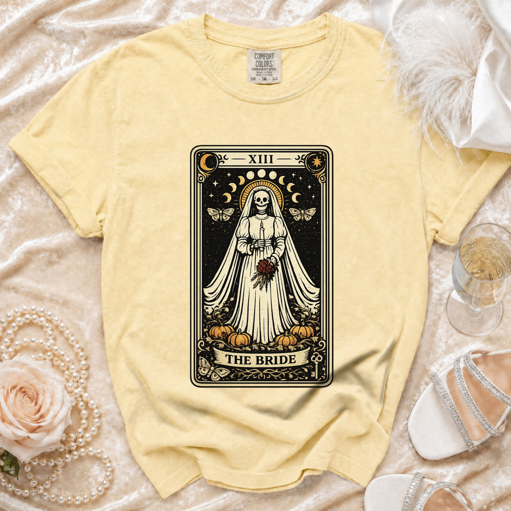 Yellow t-shirt with "The Bride" tarot card design featuring a skeleton bride and pumpkins.
