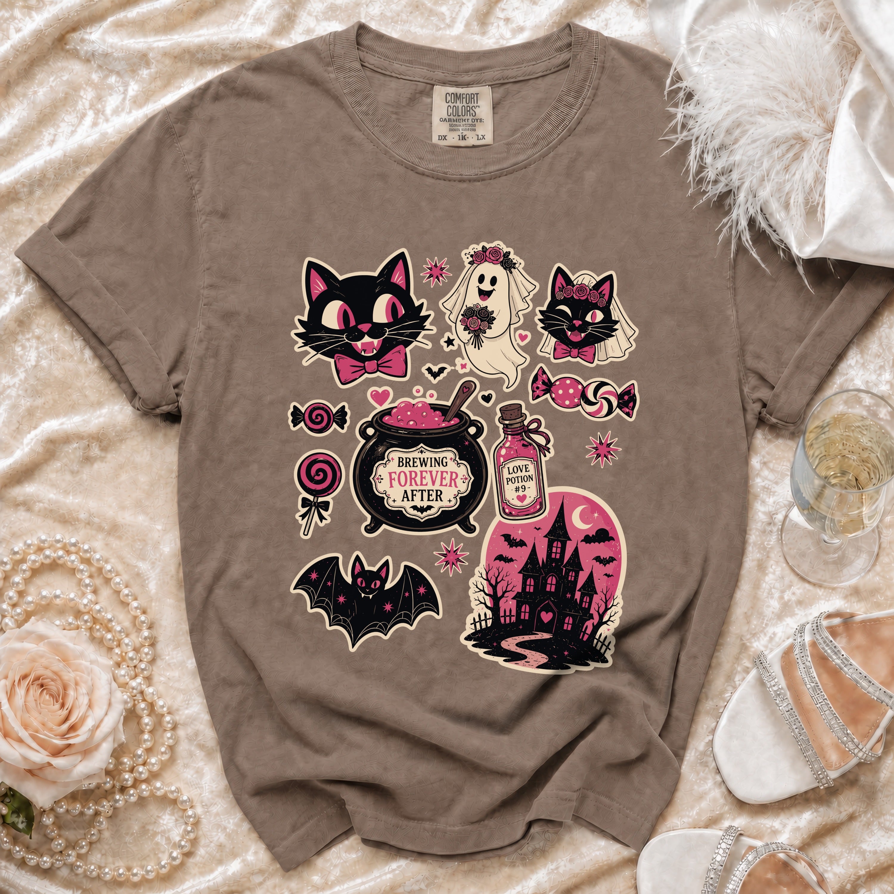 Brown t-shirt with Halloween-themed graphics including cats, a ghost bride, and a haunted house.