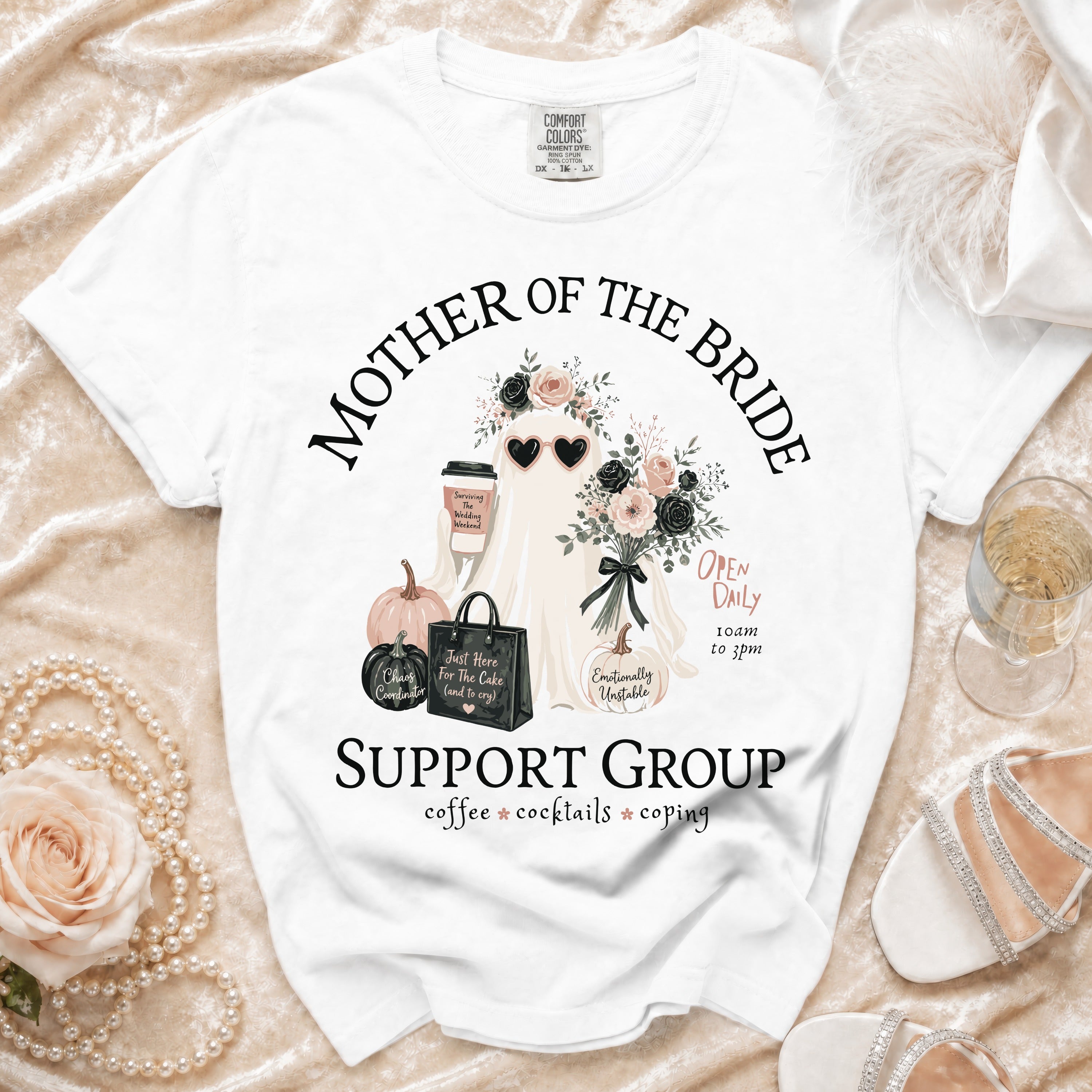 White t-shirt with "Mother of the Bride Support Group" graphic, ghost, coffee, and pumpkins.