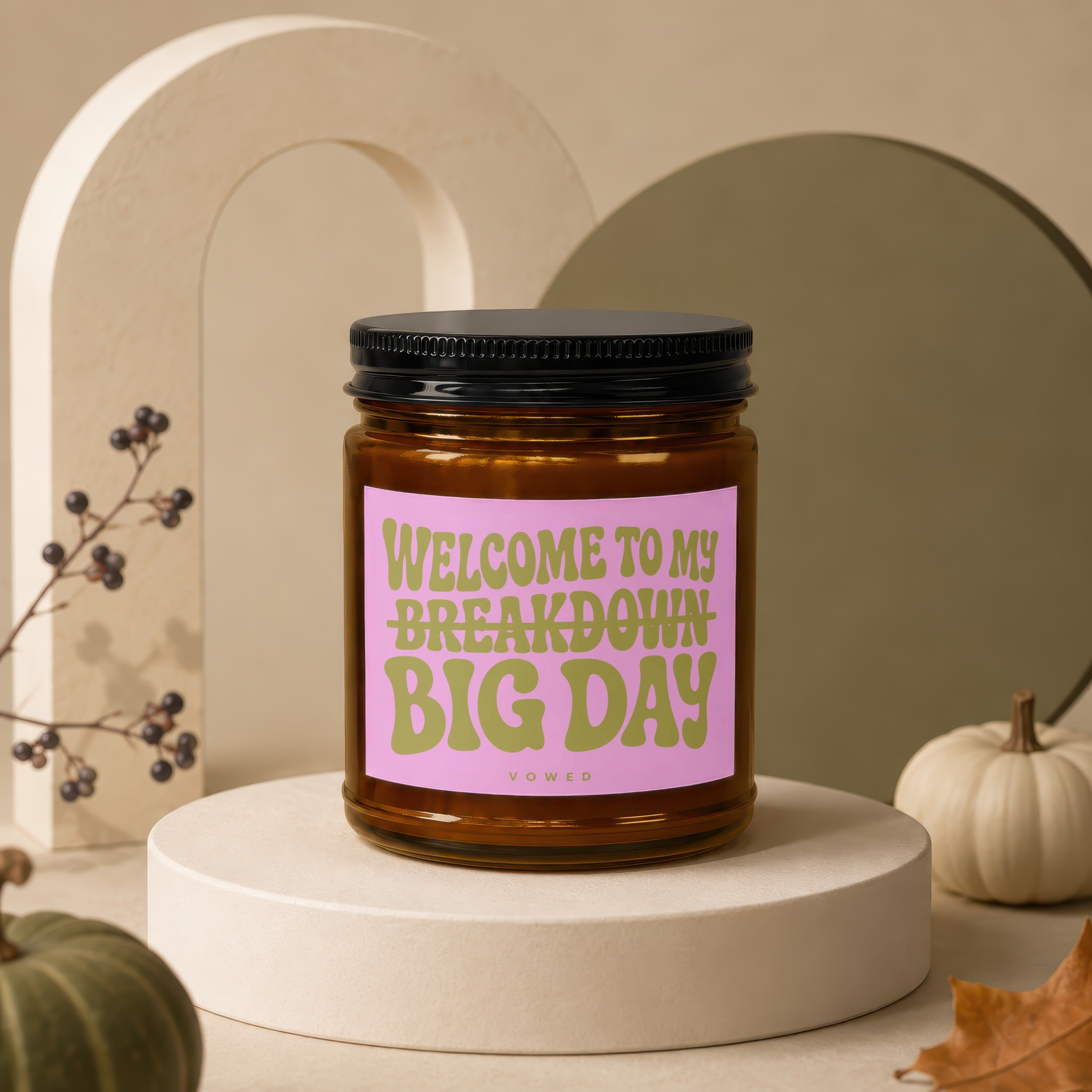 Candle with pink label reading "Welcome to my breakdown big day"