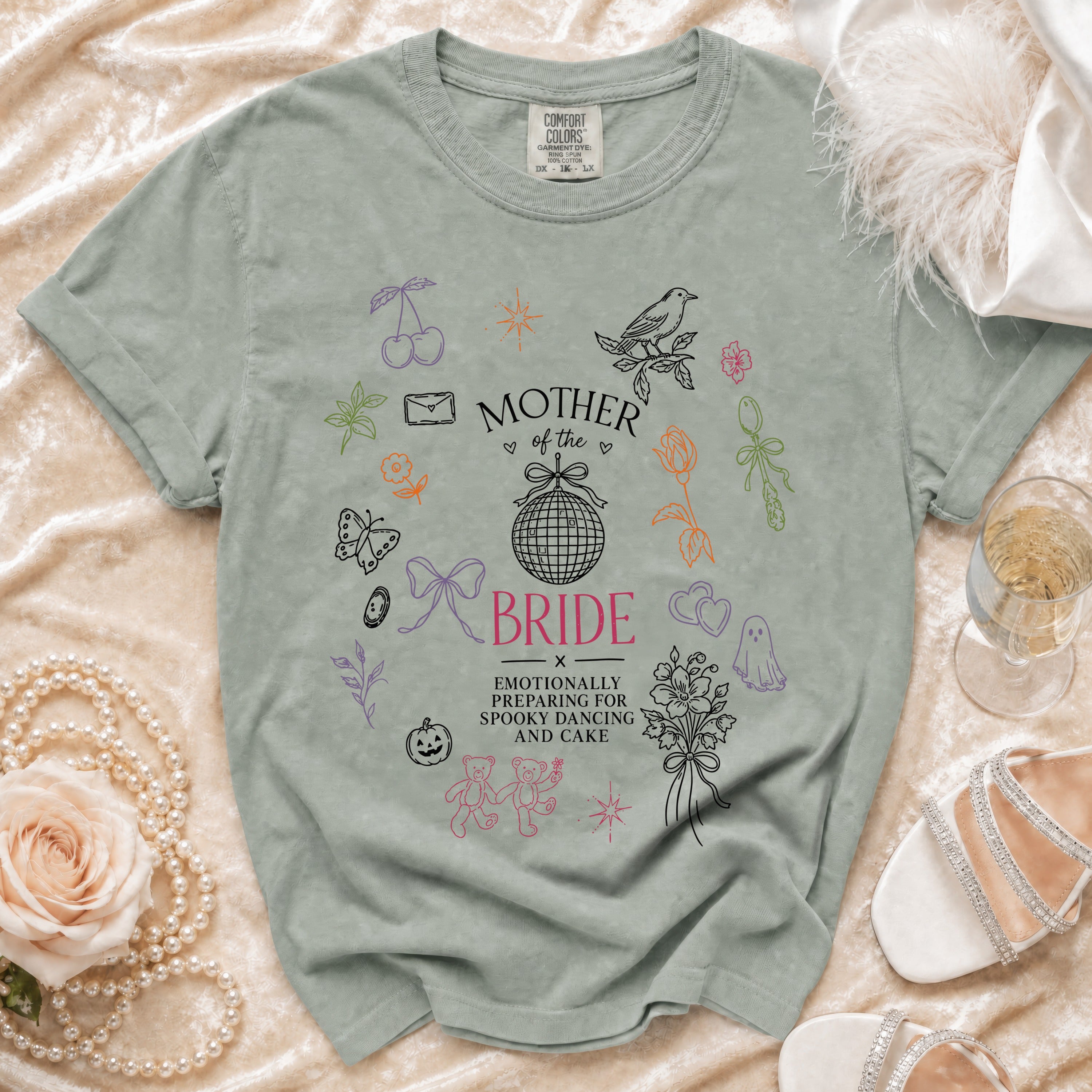 Light green t-shirt with "Mother of the Bride" and "Emotionally Preparing for Spooky Dancing and Cake" text.