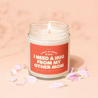 Lit candle with label "Light me when I need a hug from my other mom."